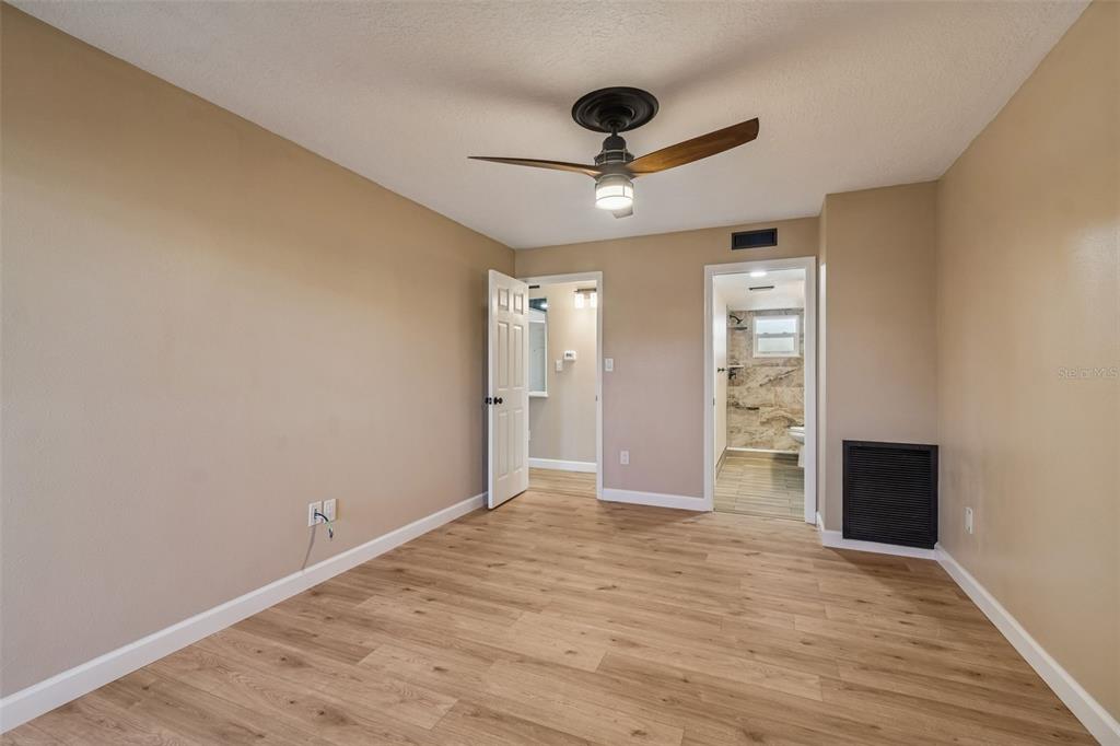 4937 Marine Parkway, Unit 105 New Port Richey, FL 34652 - Photo 22 of 50 a view of an empty room with a kitchen and a window