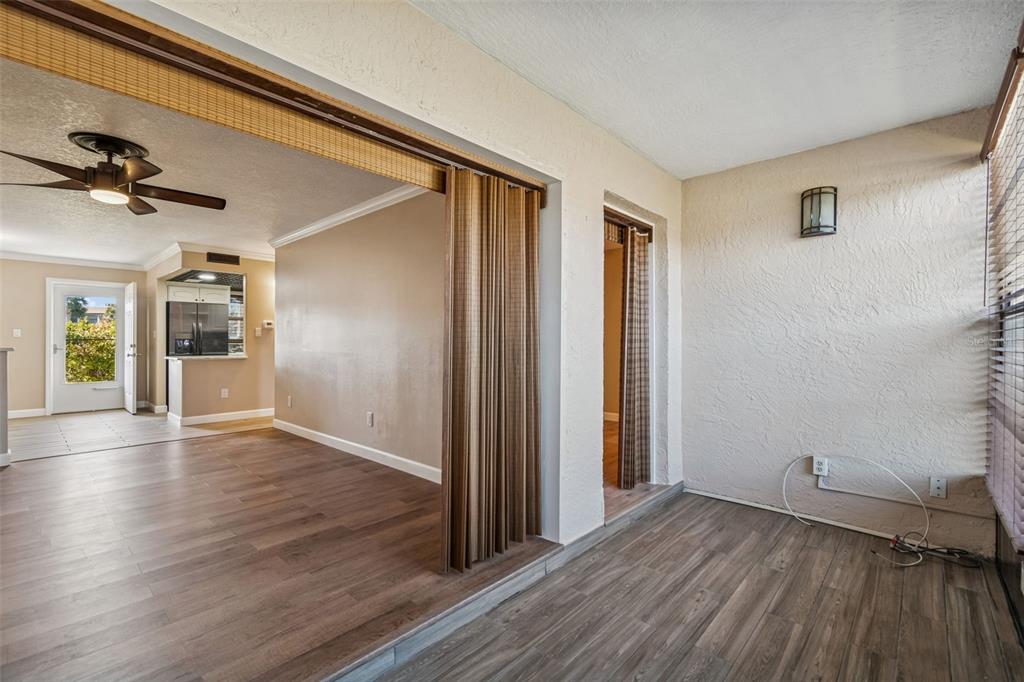 4937 Marine Parkway, Unit 105 New Port Richey, FL 34652 - Photo 25 of 50 wooden floor in an empty room with a window