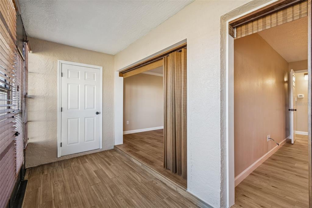 4937 Marine Parkway, Unit 105 New Port Richey, FL 34652 - Photo 27 of 50 a view of a hallway with wooden floor