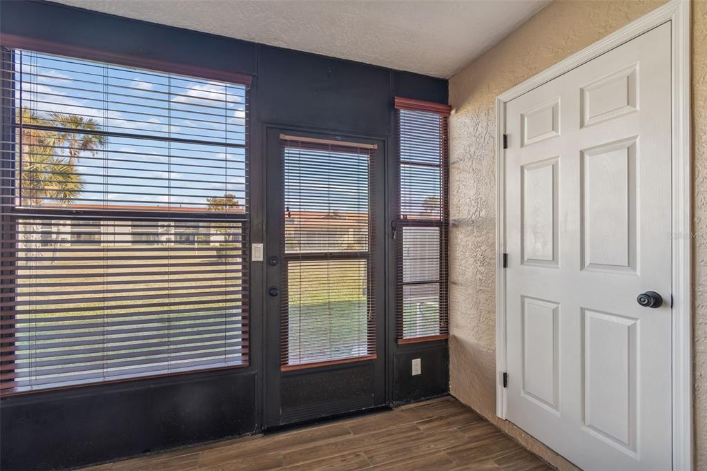 4937 Marine Parkway, Unit 105 New Port Richey, FL 34652 - Photo 28 of 50 a view of wooden floor and windows in a room