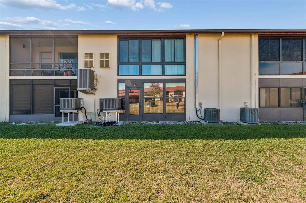 4937 Marine Parkway, Unit 105 New Port Richey, FL 34652 - Photo 37 of 50 front view of house with a yard