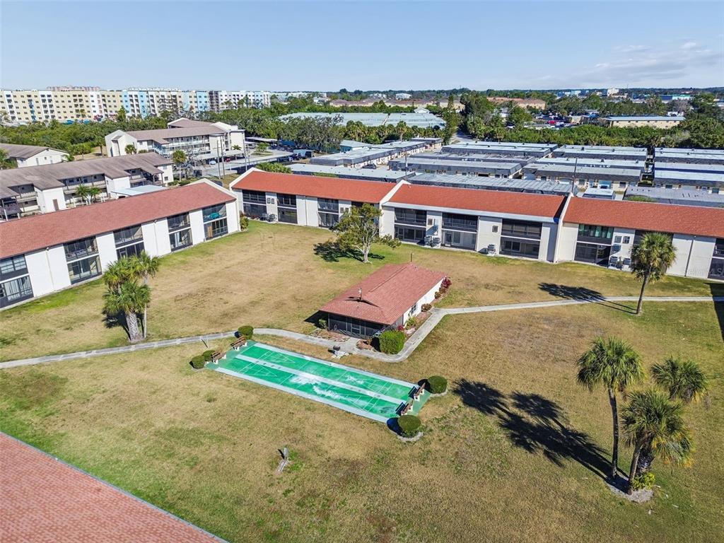 4937 Marine Parkway, Unit 105 New Port Richey, FL 34652 - Photo 42 of 50 an aerial view of multiple houses with a yard