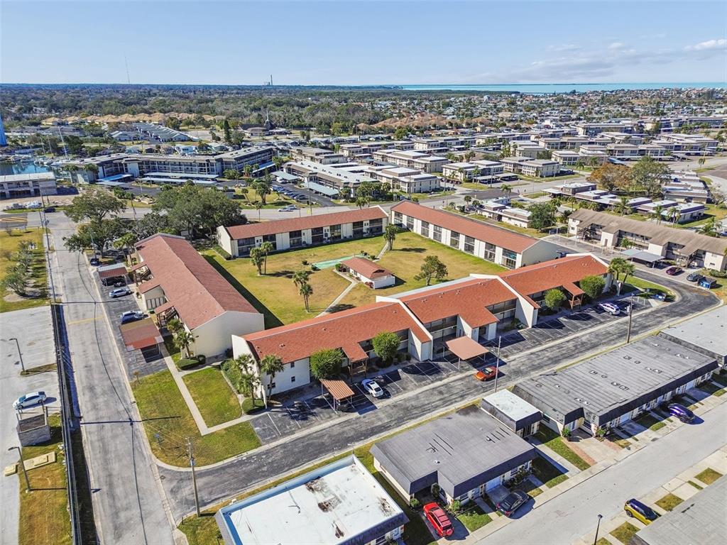 4937 Marine Parkway, Unit 105 New Port Richey, FL 34652 - Photo 43 of 50 an aerial view of residential houses with outdoor space