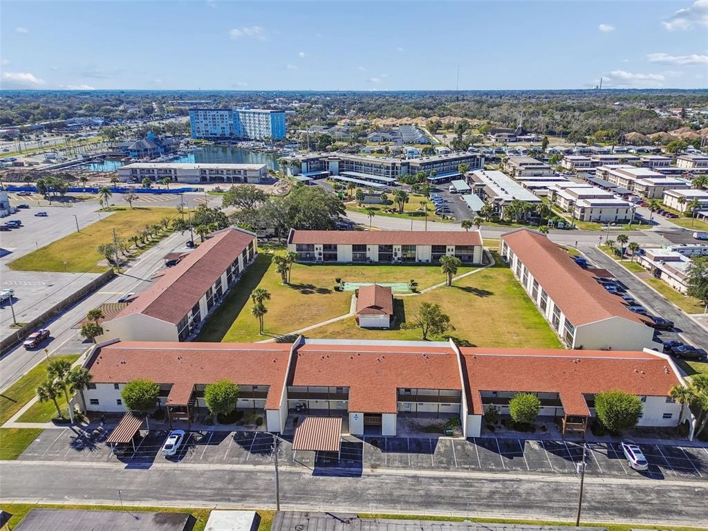 4937 Marine Parkway, Unit 105 New Port Richey, FL 34652 - Photo 44 of 50 an aerial view of a house with a swimming pool