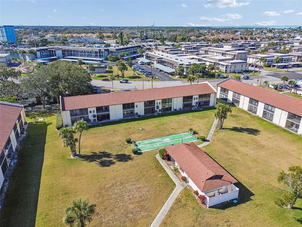 4937 Marine Parkway, Unit 105 New Port Richey, FL 34652 - Photo 45 of 50 a view of a swimming pool with a lake view