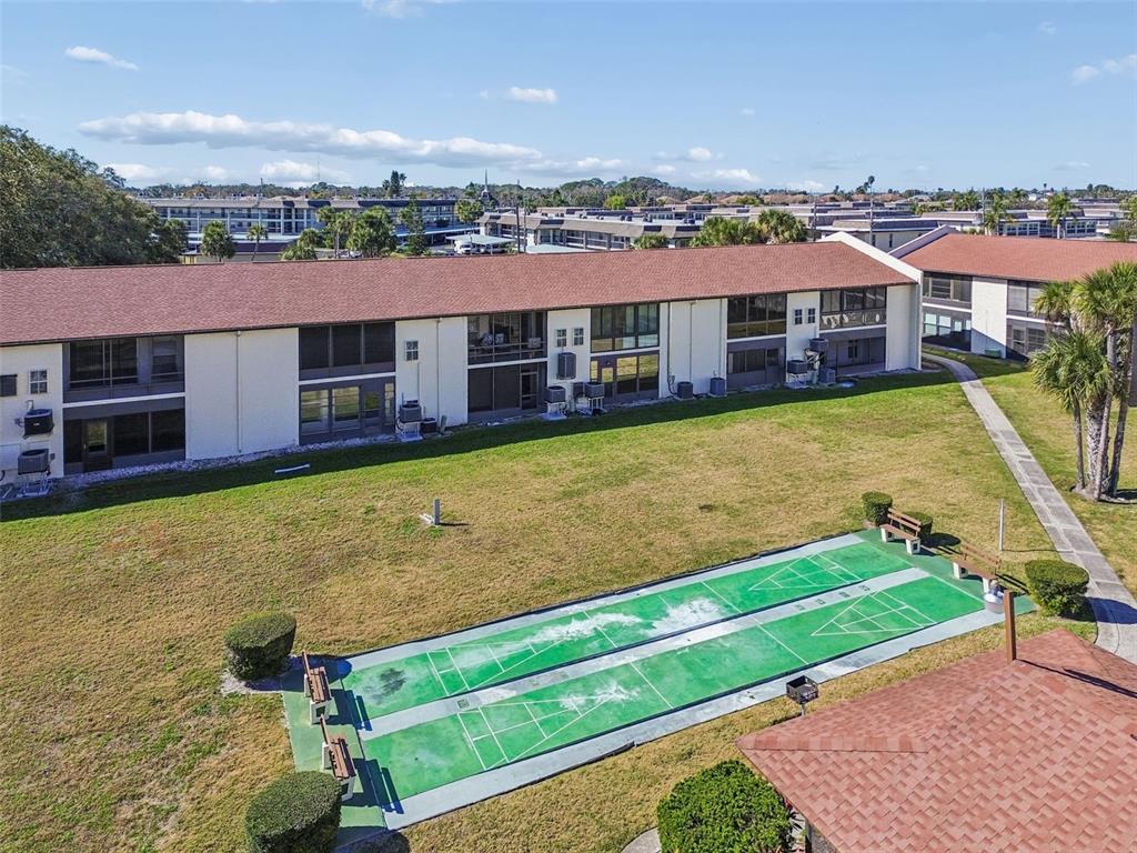4937 Marine Parkway, Unit 105 New Port Richey, FL 34652 - Photo 46 of 50 swimming pool with outdoor seating and yard