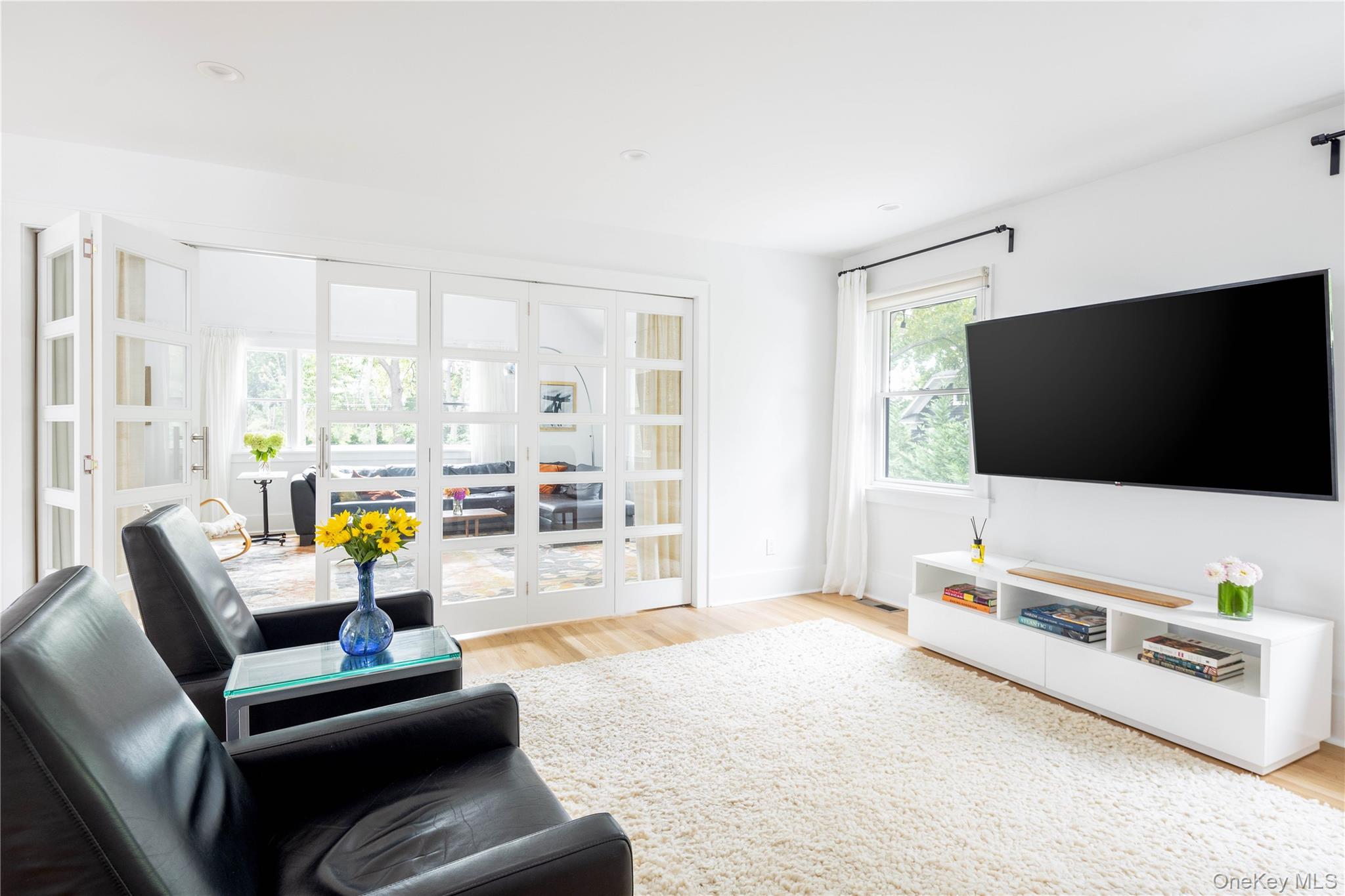 1260 Main Road Jamesport, NY 11901 - Photo 12 of 22 a living room with furniture and a flat screen tv