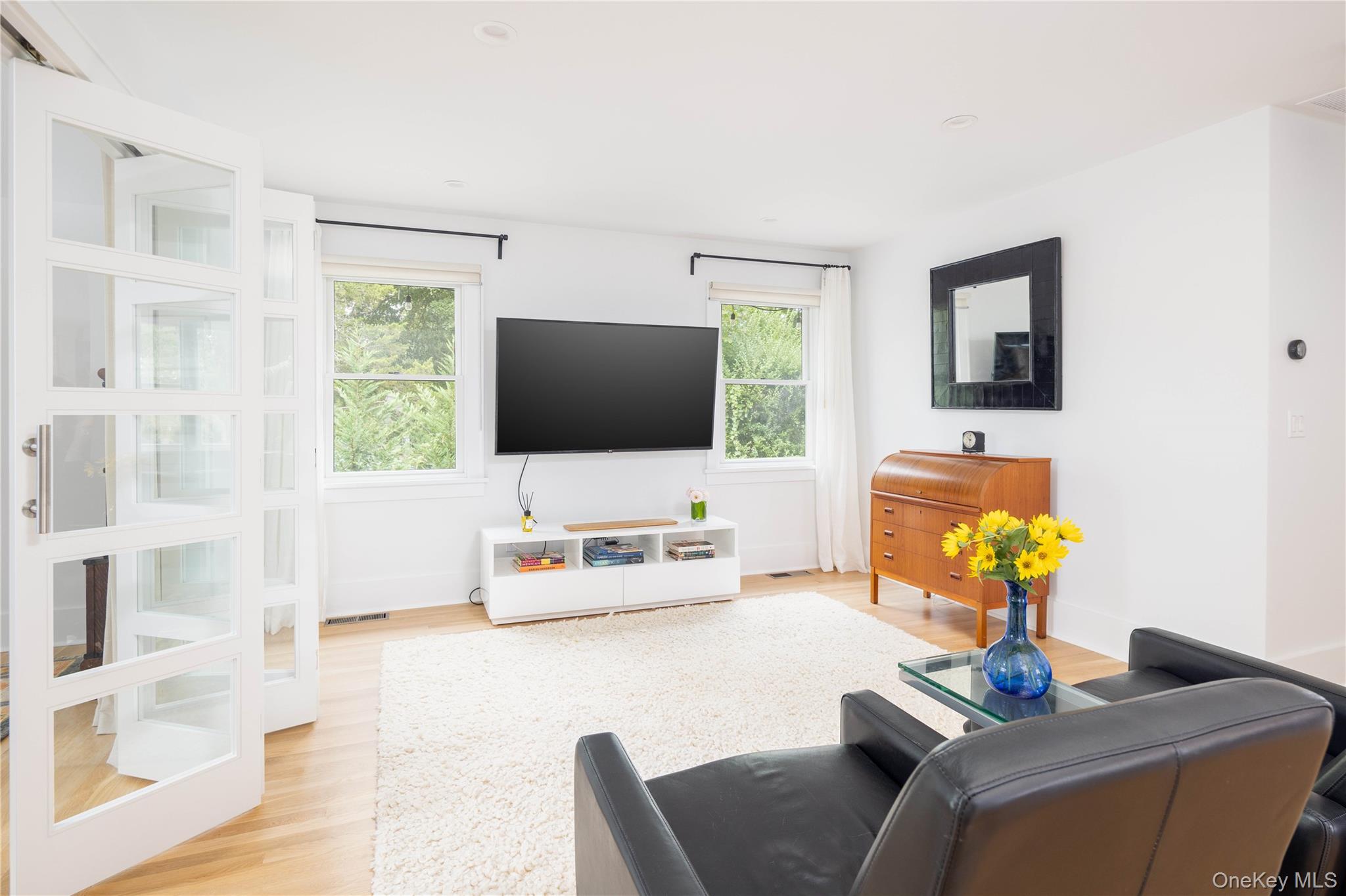 1260 Main Road Jamesport, NY 11901 - Photo 13 of 22 a living room with furniture and a flat screen tv