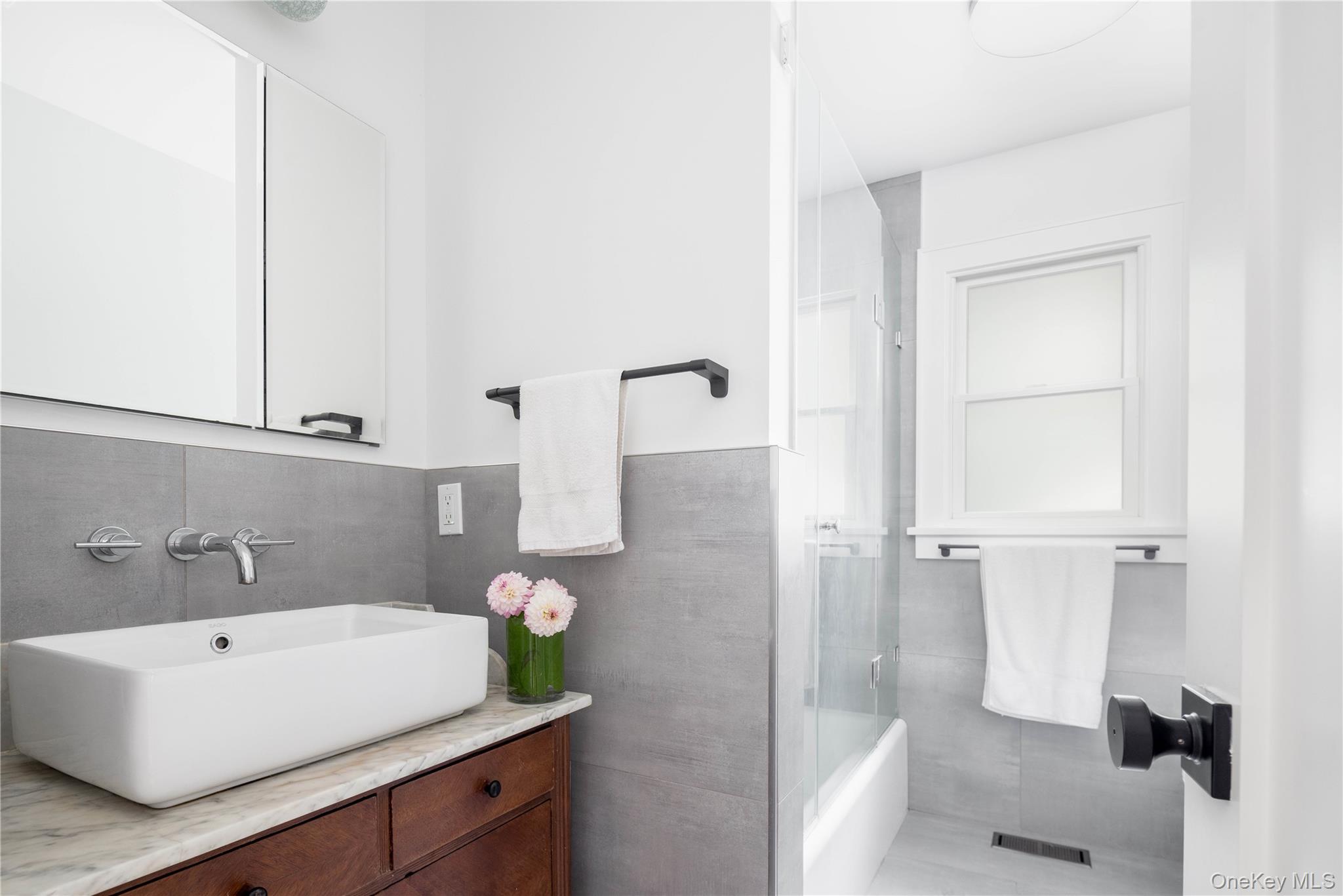 1260 Main Road Jamesport, NY 11901 - Photo 21 of 22 a bathroom with a sink and a mirror