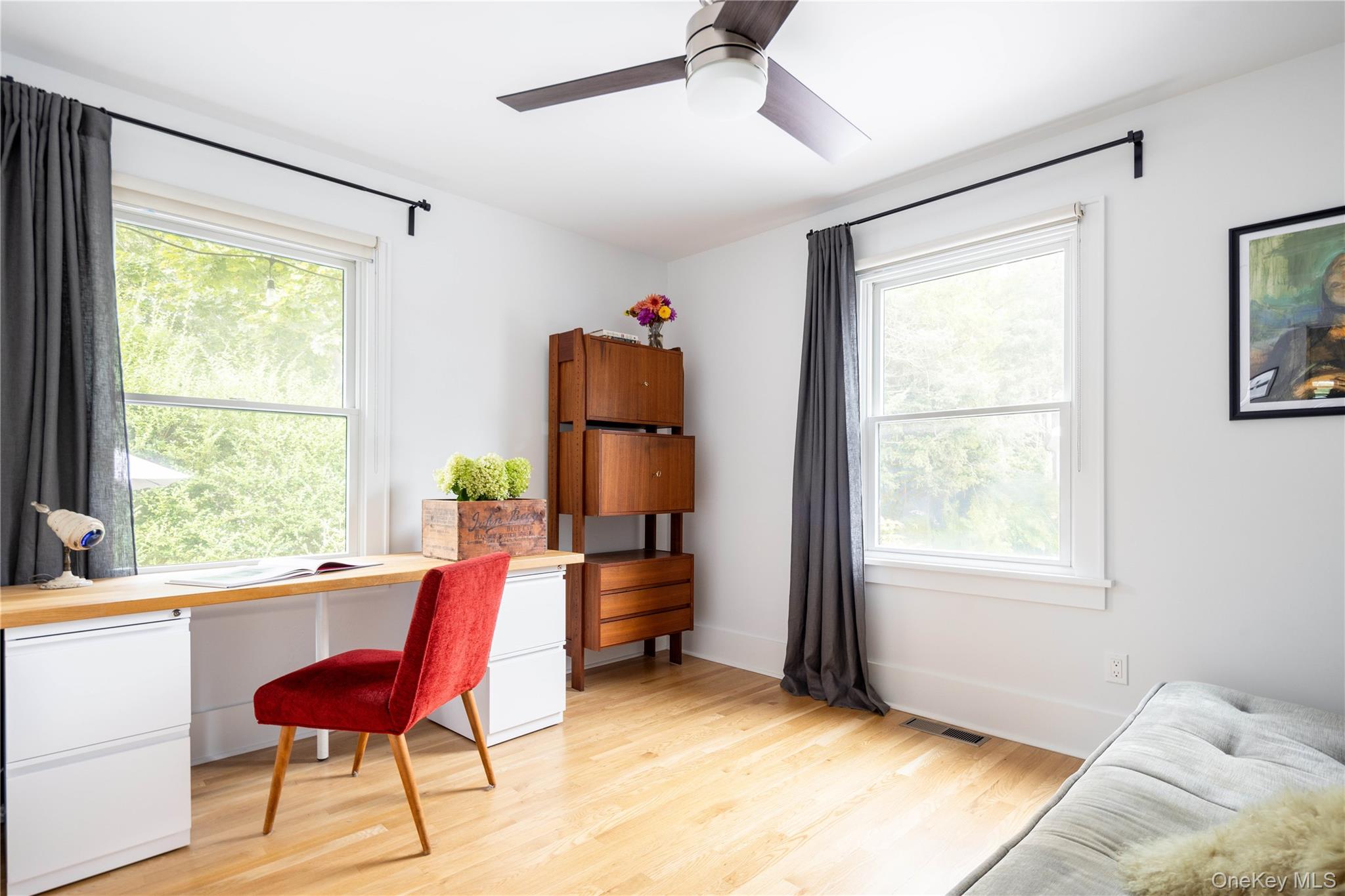 1260 Main Road Jamesport, NY 11901 - Photo 22 of 22 a bedroom with a bed and a window