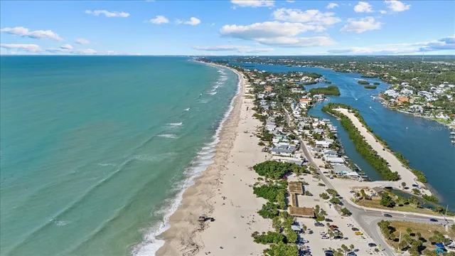 a view of a street with cars parked