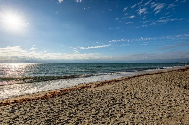 a view of balcony with wooden floor and fence