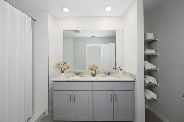 a bathroom with a sink and a mirror
