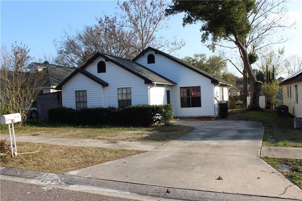586 Conure Street Apopka, FL 32712 - Photo 1 of 1 a view of a house with a yard