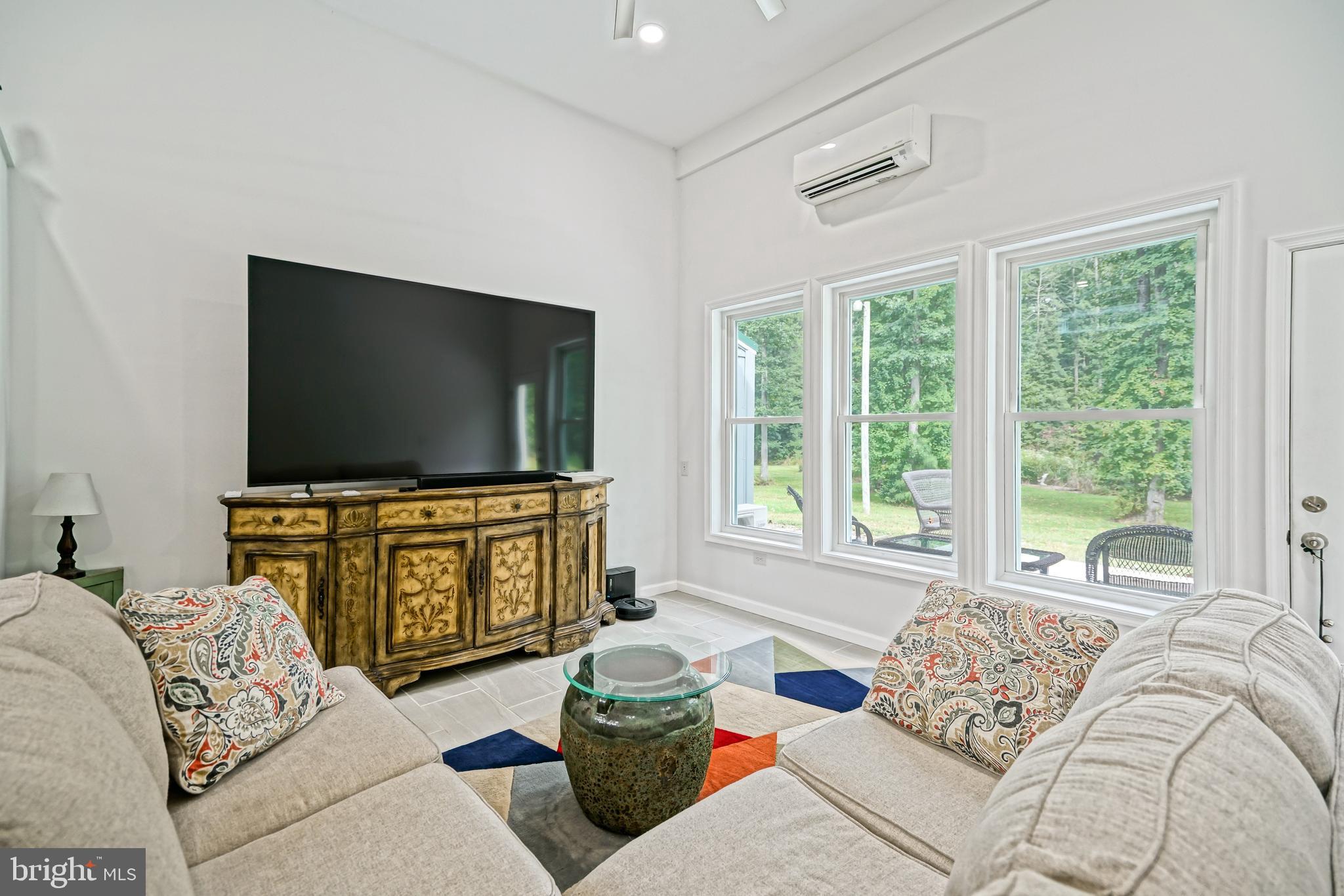 18897 Sand Hill Road Milton, DE 19968 - Photo 18 of 51 a living room with furniture and a flat screen tv