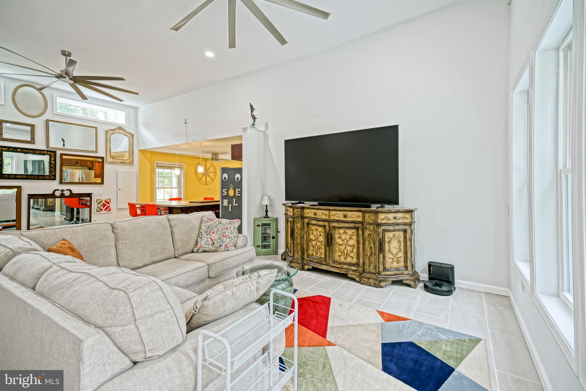 18897 Sand Hill Road Milton, DE 19968 - Photo 19 of 51 a living room with furniture and a flat screen tv