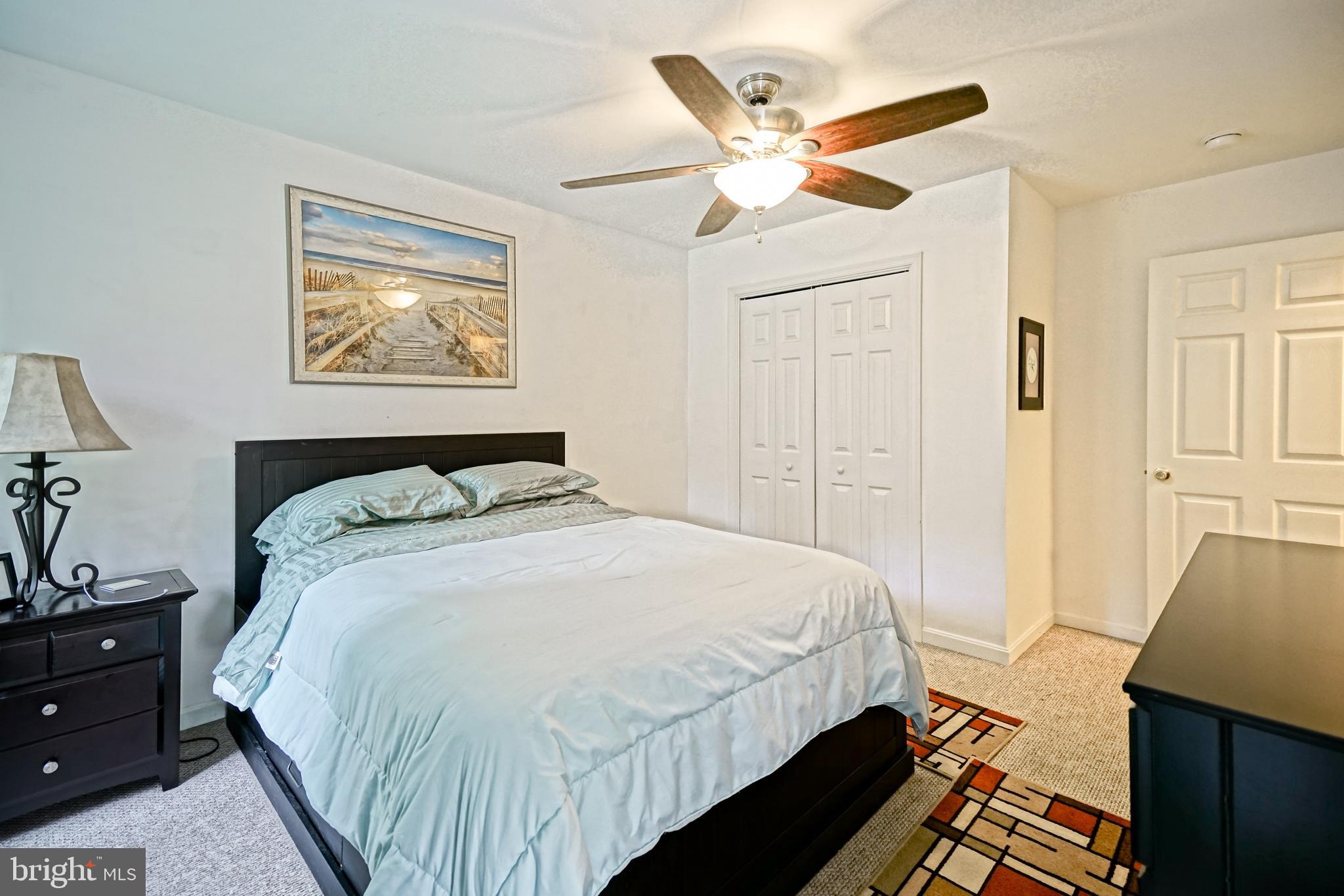 18897 Sand Hill Road Milton, DE 19968 - Photo 26 of 51 a bedroom with bed and wooden floor