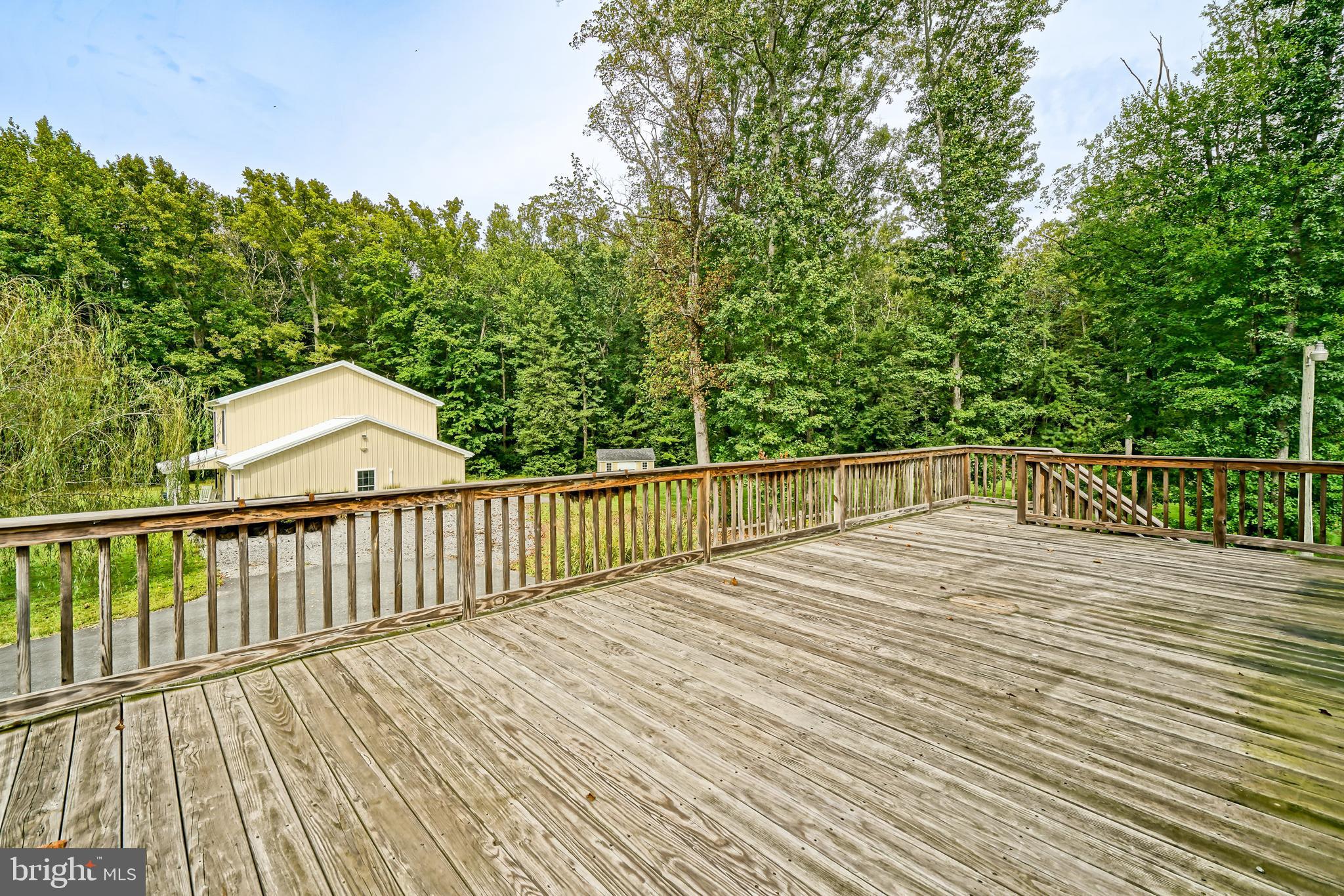 18897 Sand Hill Road Milton, DE 19968 - Photo 33 of 51 a view of a wooden deck