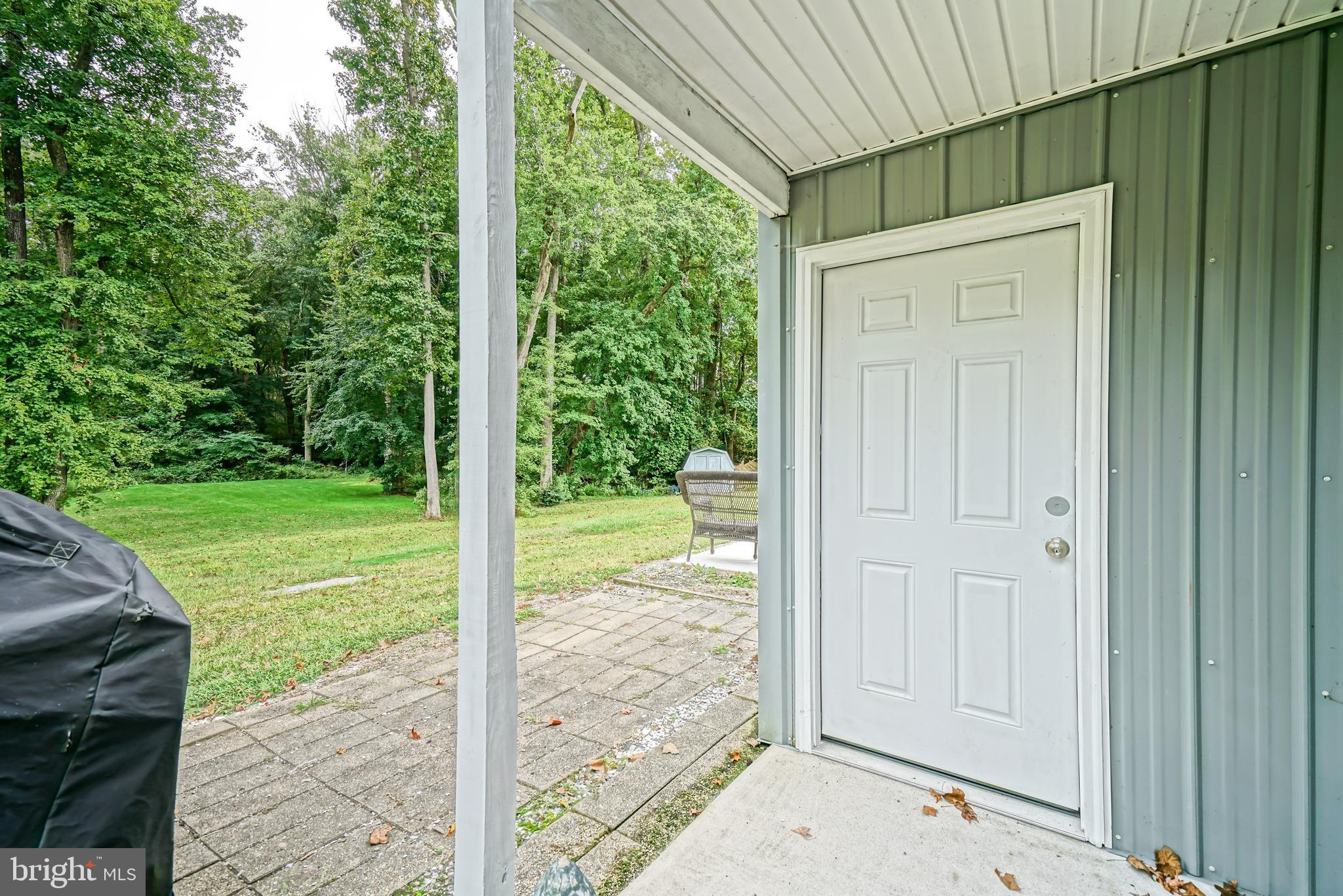 18897 Sand Hill Road Milton, DE 19968 - Photo 35 of 51 a view of a backyard with a garden