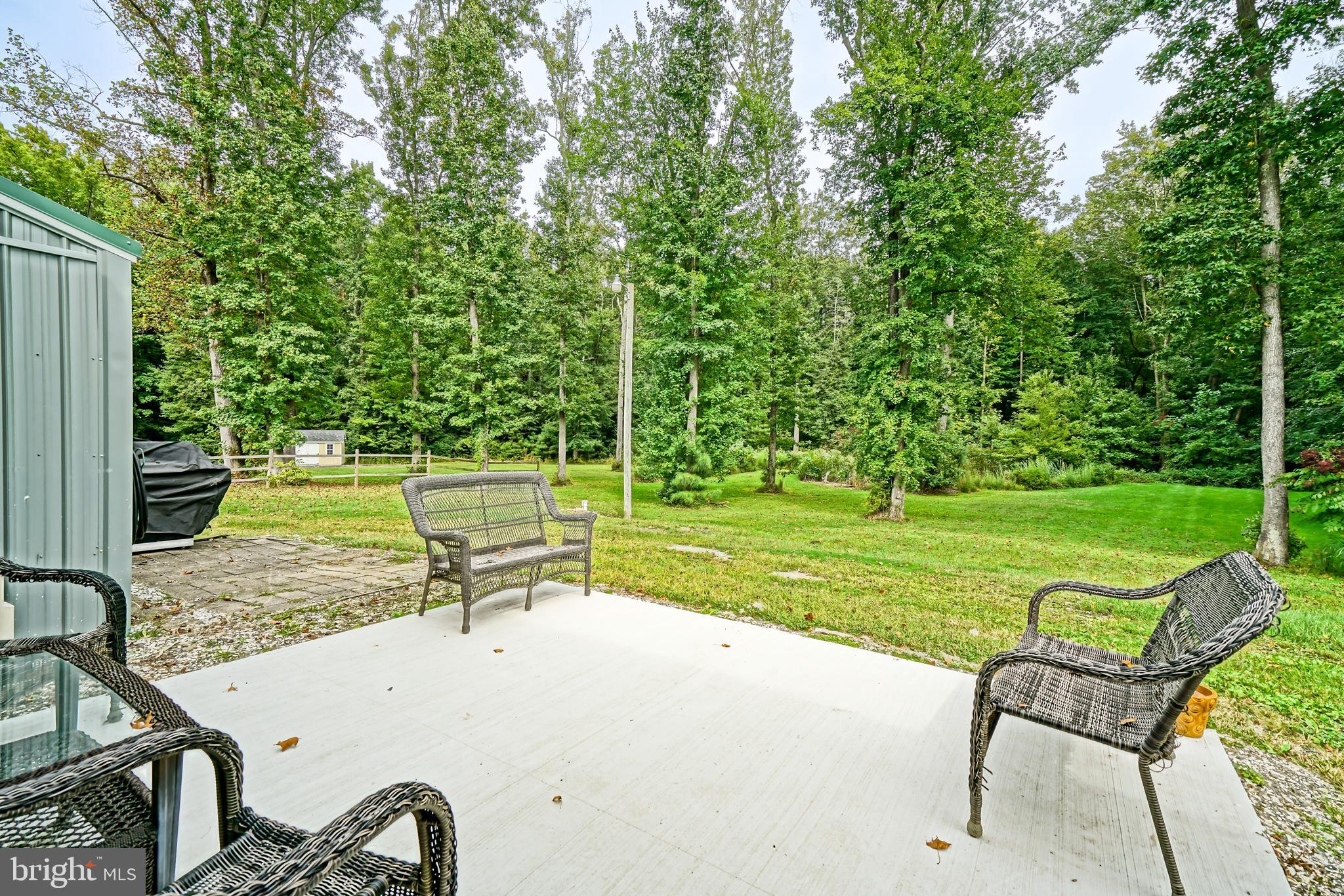 18897 Sand Hill Road Milton, DE 19968 - Photo 38 of 51 a view of a bench in the garden