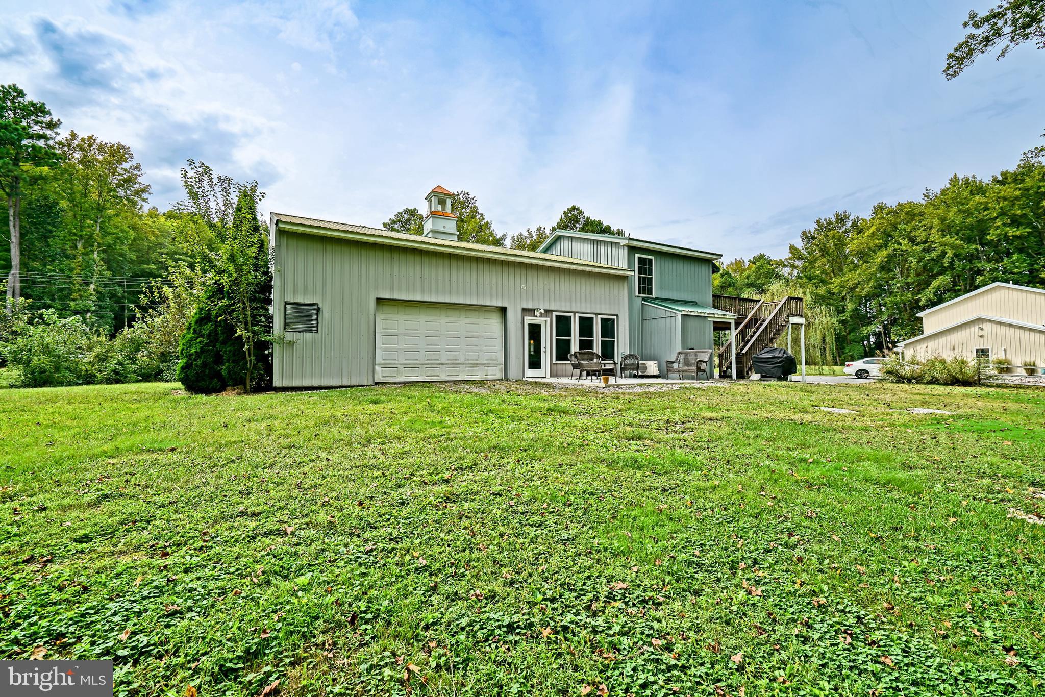 18897 Sand Hill Road Milton, DE 19968 - Photo 44 of 51 a front view of house with a garden