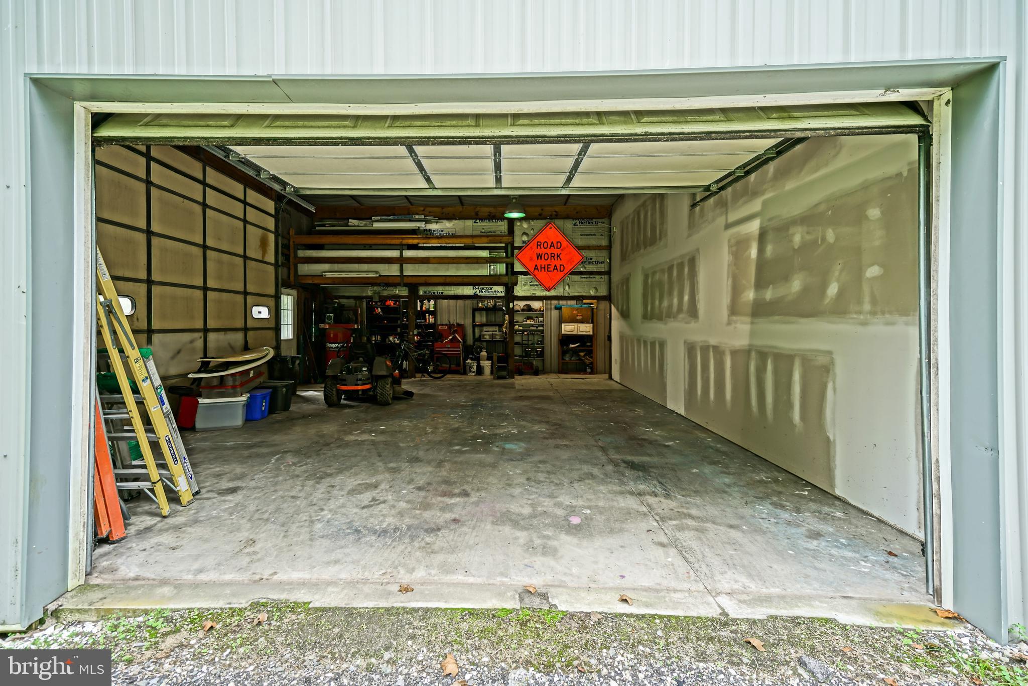 18897 Sand Hill Road Milton, DE 19968 - Photo 45 of 51 a view of a garage with a table and chairs