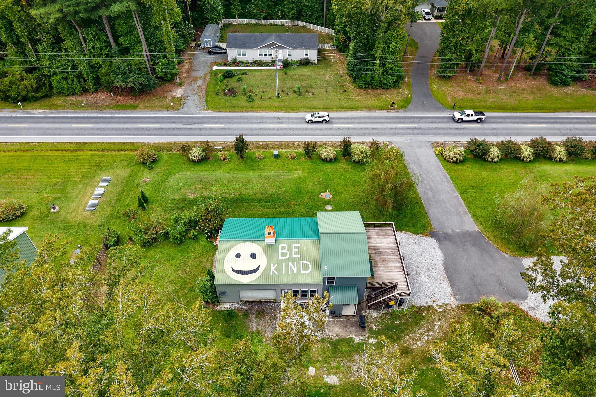 18897 Sand Hill Road Milton, DE 19968 - Photo 49 of 51 a view of a swimming pool with a yard and plants