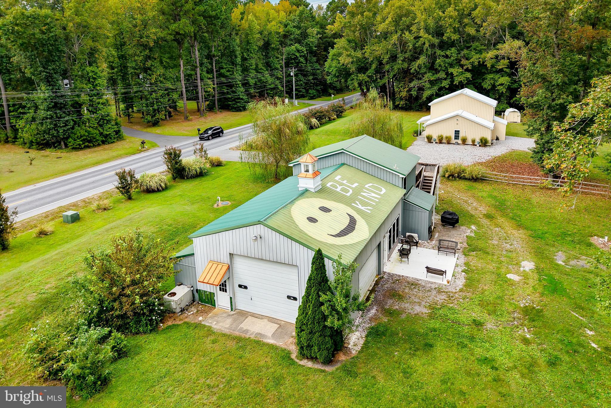 18897 Sand Hill Road Milton, DE 19968 - Photo 51 of 51 a swimming pool with a bench and trees in the background