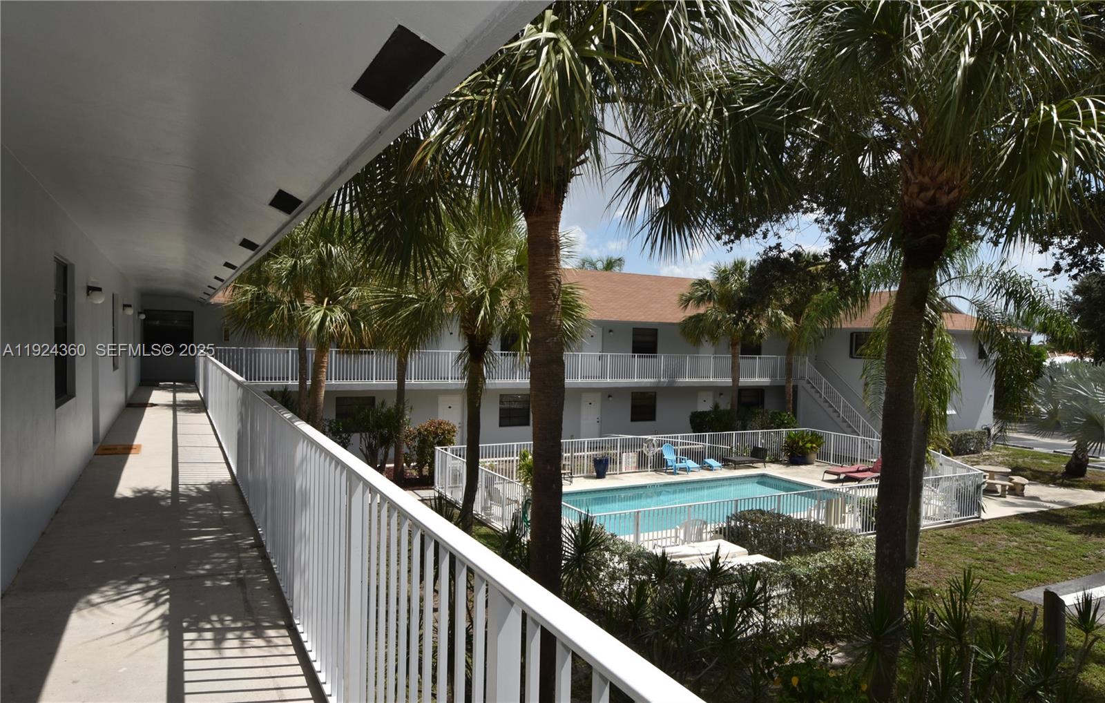 1401 Northeast 53rd Street, Unit 211 Fort Lauderdale, FL 33334 - Photo 11 of 14 a balcony with view of swimming pool