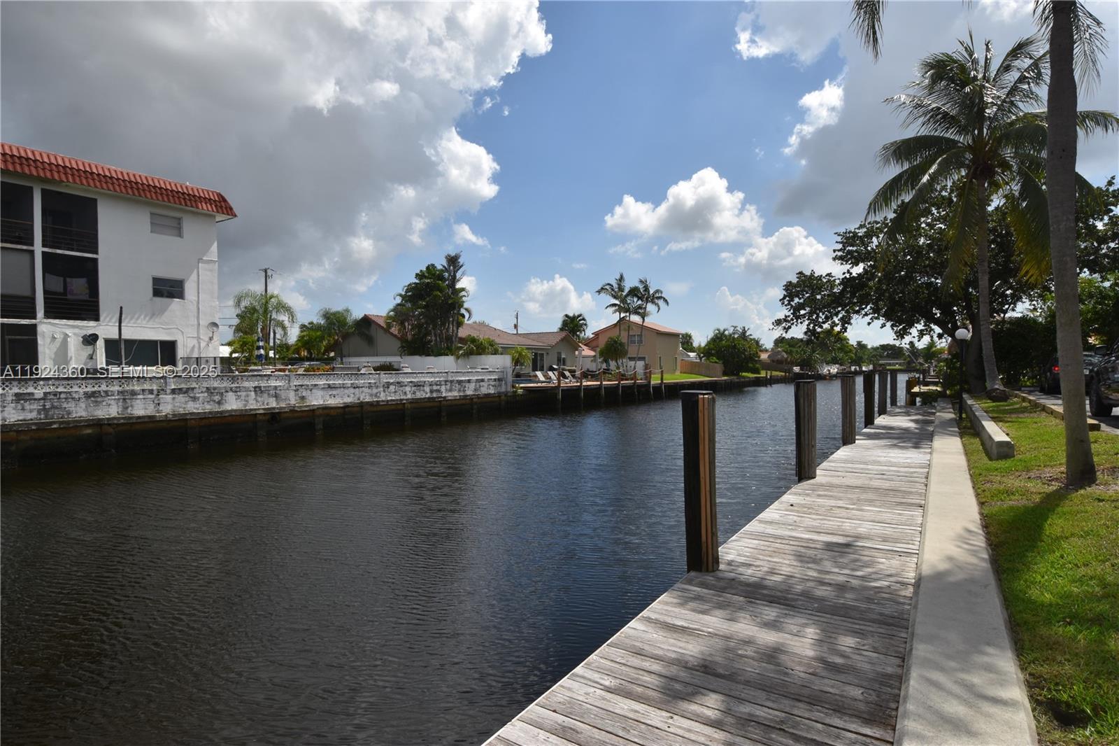 1401 Northeast 53rd Street, Unit 211 Fort Lauderdale, FL 33334 - Photo 13 of 14 a view of a lake with a large trees