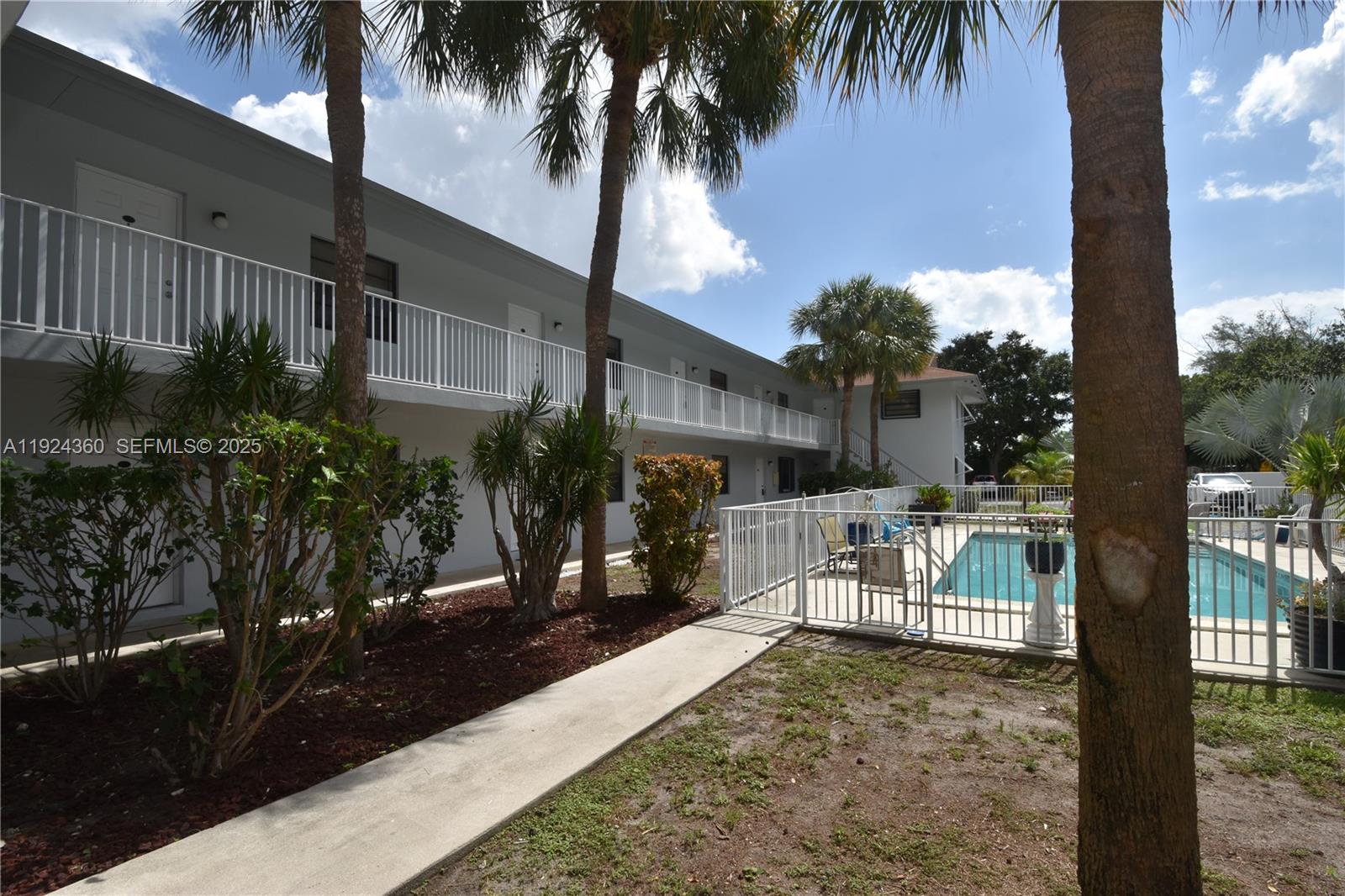 1401 Northeast 53rd Street, Unit 211 Fort Lauderdale, FL 33334 - Photo 9 of 14 a view of a yard with a patio