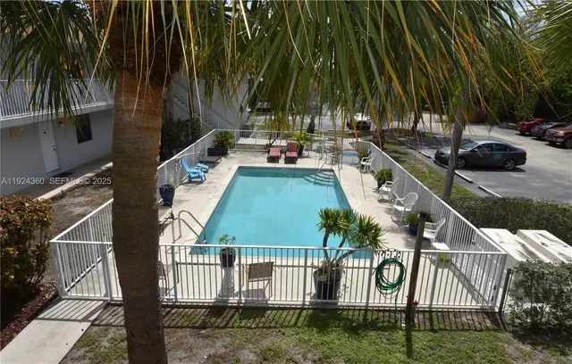 a view of swimming pool with a patio