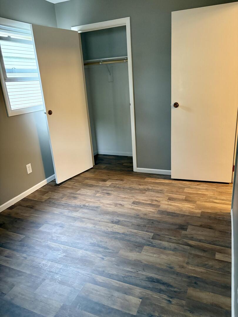 1401 Dillon Drive Normal, IL 61761 - Photo 11 of 17 an empty room with wooden floor