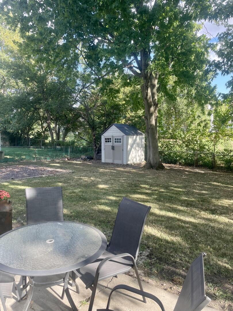 1401 Dillon Drive Normal, IL 61761 - Photo 17 of 17 a backyard of a house with table and chairs