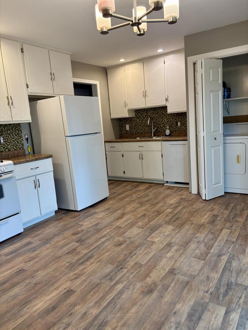 1401 Dillon Drive Normal, IL 61761 - Photo 3 of 17 a view of a kitchen with wooden floor