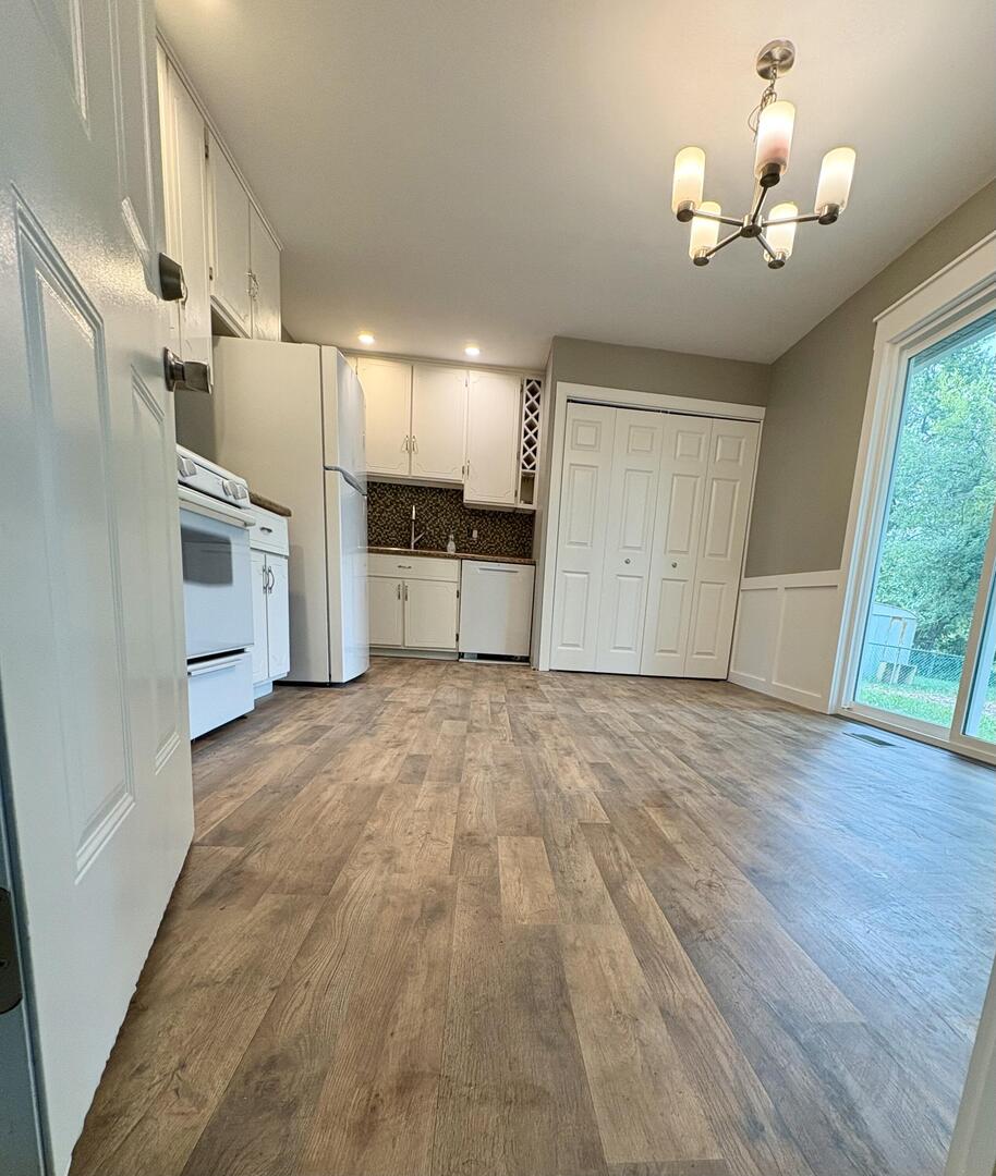 1401 Dillon Drive Normal, IL 61761 - Photo 6 of 17 a view of a kitchen with a sink and dishwasher wooden floor