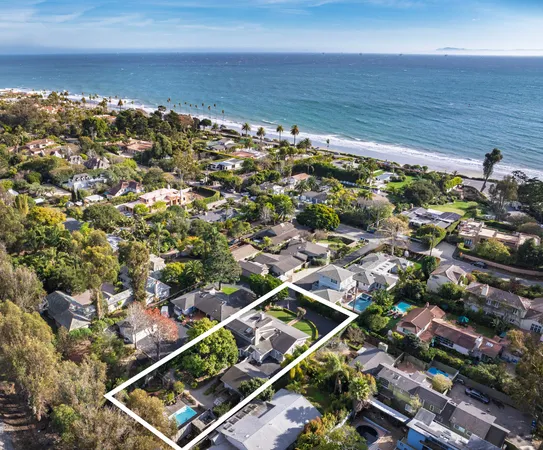 a front view of a house with a yard table and chairs