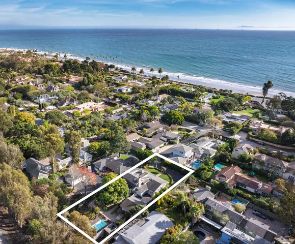 a front view of a house with a yard table and chairs