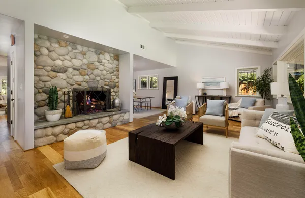 a living room with furniture and a fireplace