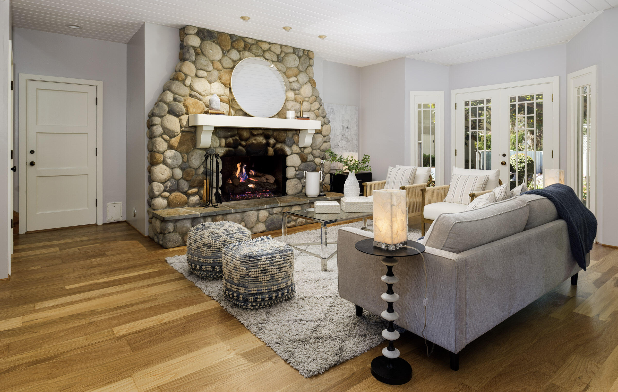 1114 Hill Road Montecito, CA 93108 - Photo 7 of 27 a living room with furniture a fireplace and a large window