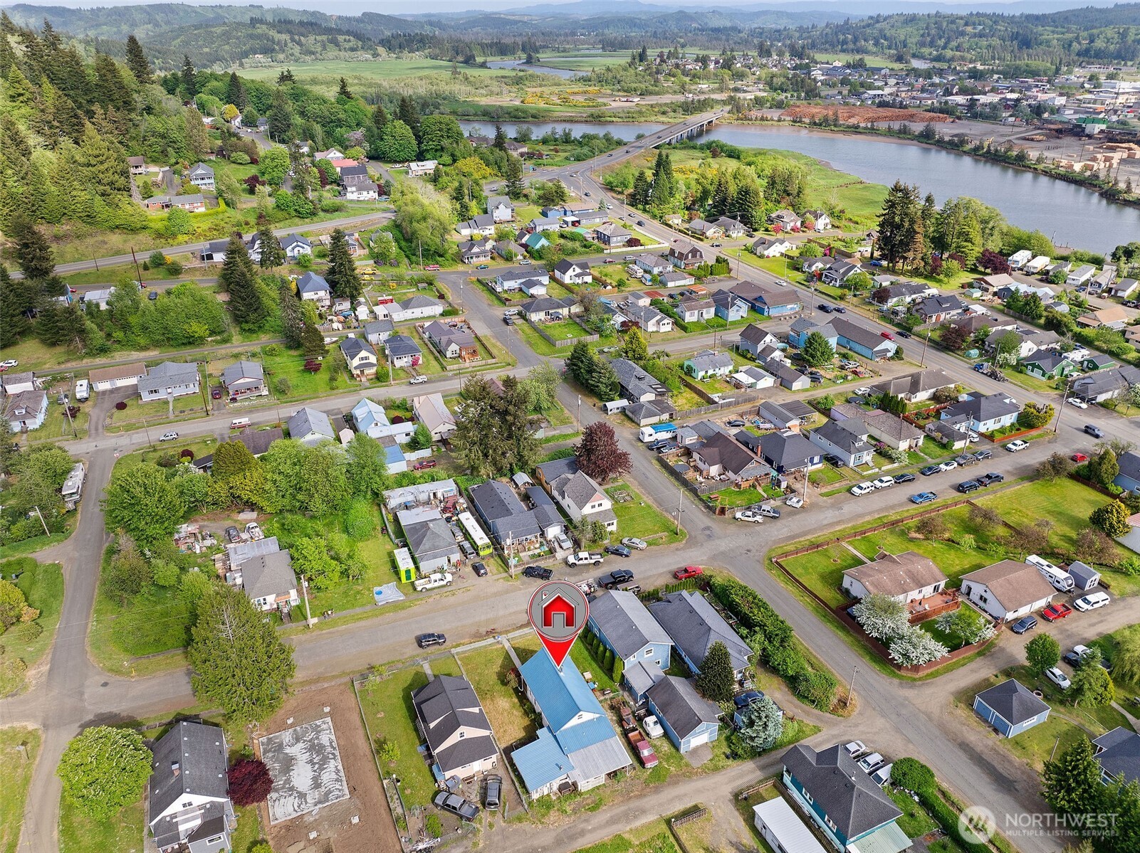 1218 Cedar Street Raymond, WA 98577 - Photo 2 of 31 an aerial view of residential houses with outdoor space