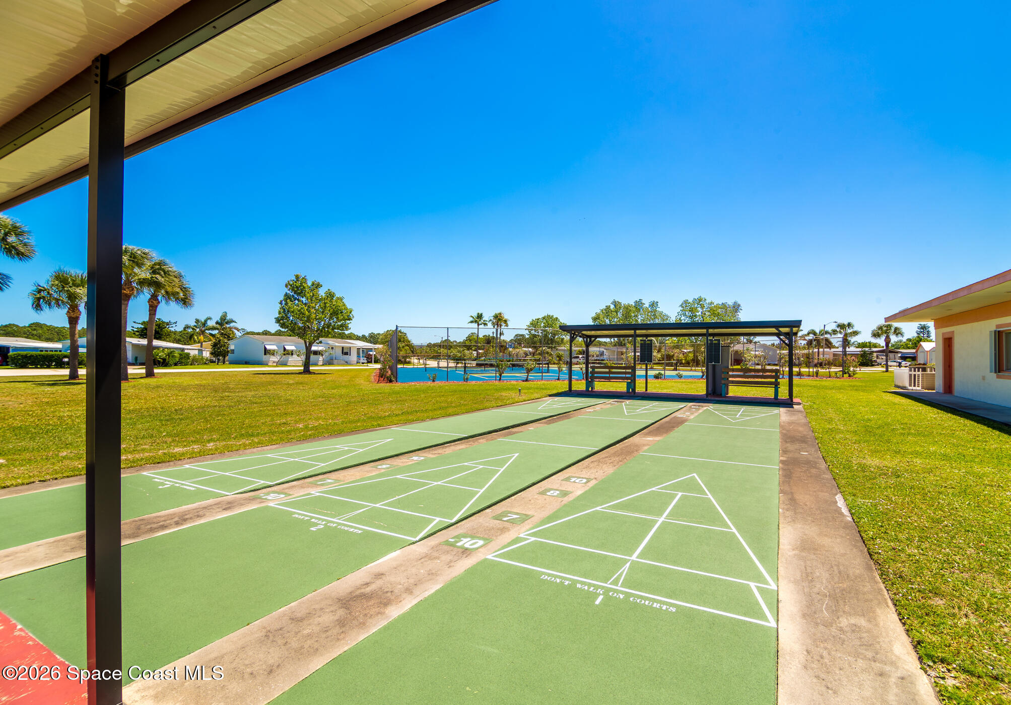 1854 Mango Street Northeast Palm Bay, FL 32905 - Photo 26 of 35 a view of a swimming pool with a lawn chairs