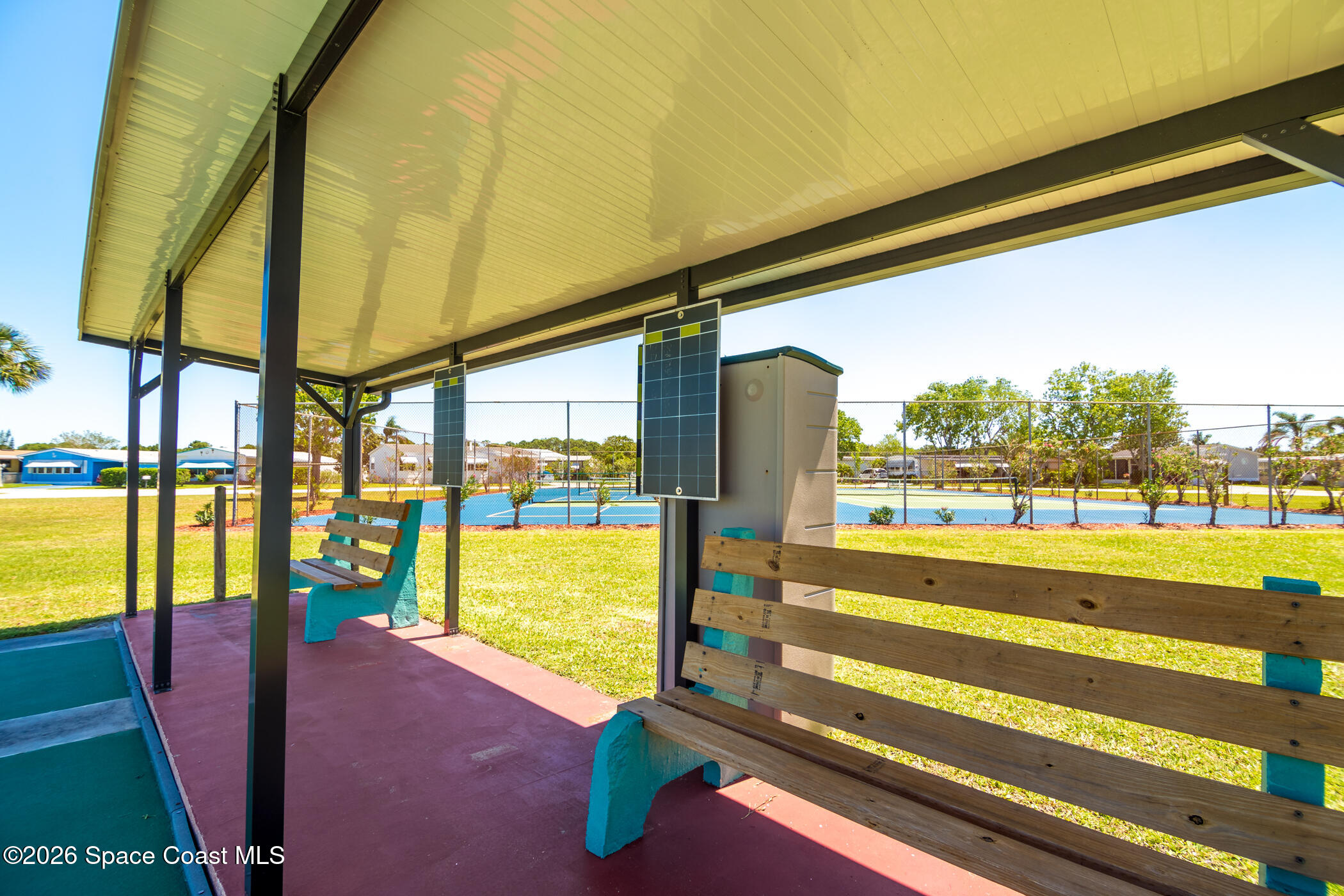 1854 Mango Street Northeast Palm Bay, FL 32905 - Photo 28 of 35 a view of swimming pool with a floor to ceiling window next to a yard