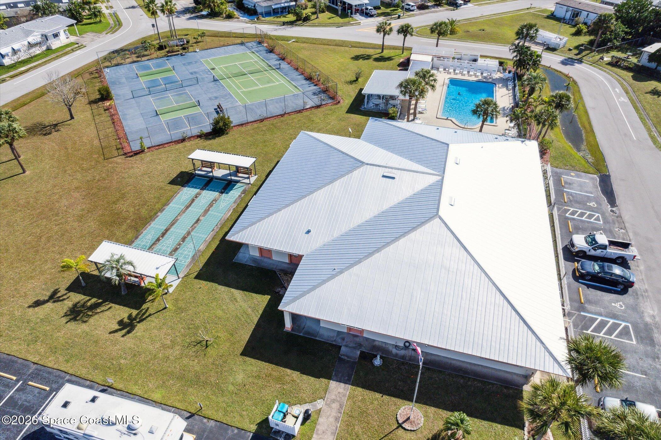1854 Mango Street Northeast Palm Bay, FL 32905 - Photo 29 of 35 an aerial view of a house with a garden