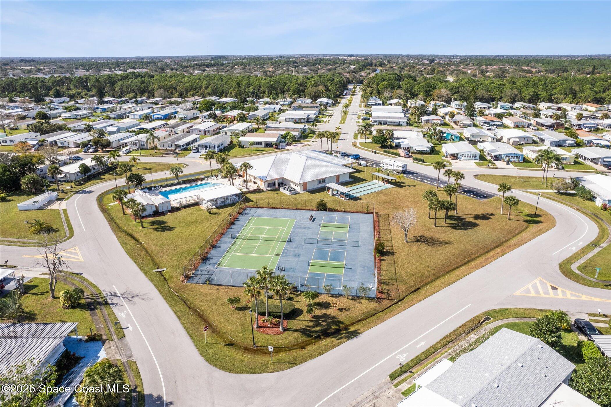 1854 Mango Street Northeast Palm Bay, FL 32905 - Photo 32 of 35 an aerial view of a house with a swimming pool