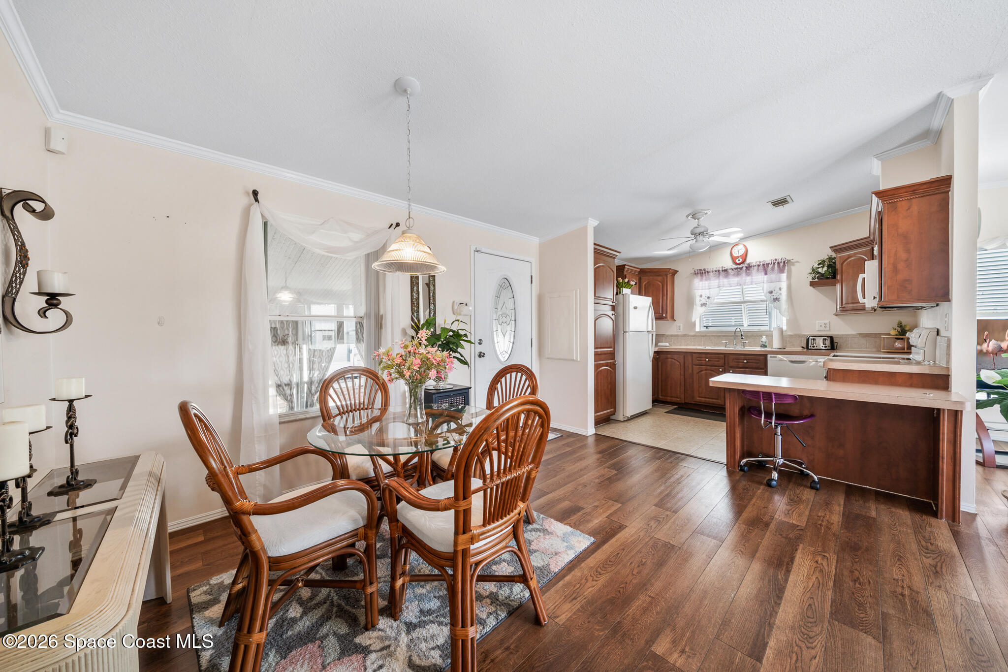 1854 Mango Street Northeast Palm Bay, FL 32905 - Photo 5 of 35 a dining room with furniture and wooden floor