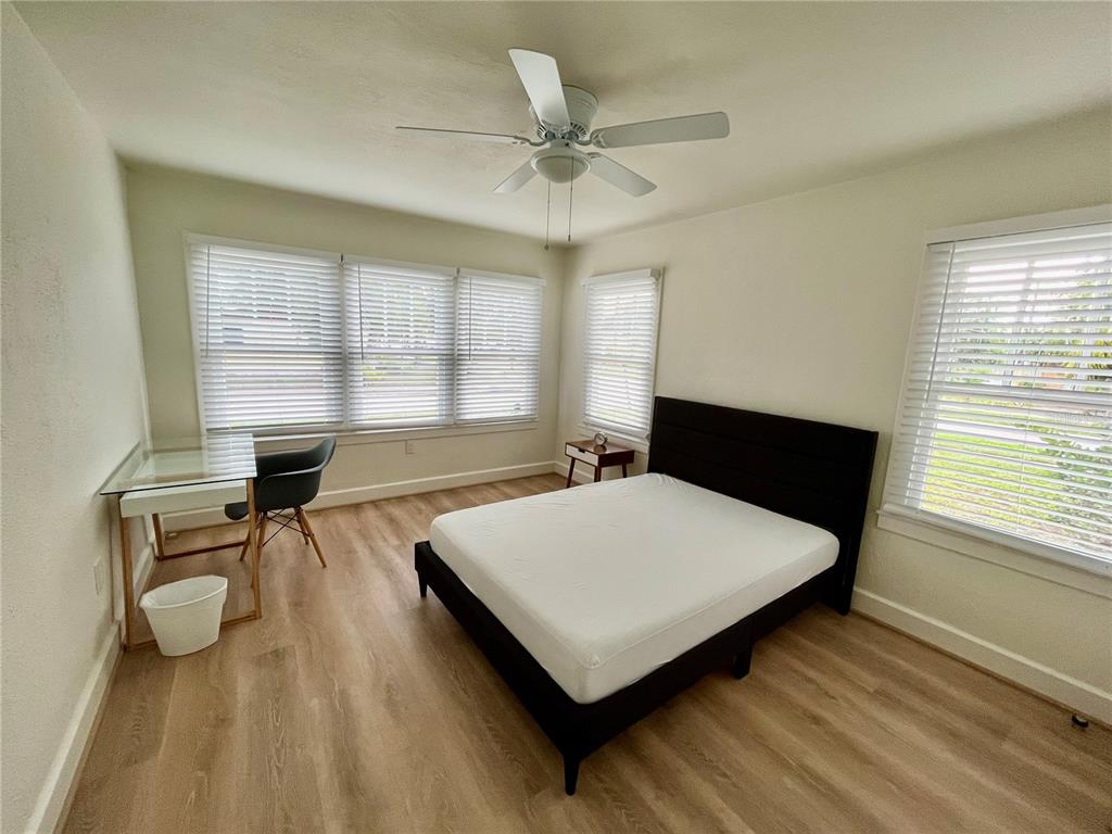3011 6th Street Sarasota, FL 34237 - Photo 15 of 23 a living room with table chairs and a wooden floor