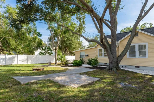 a view of a trees in front of a house