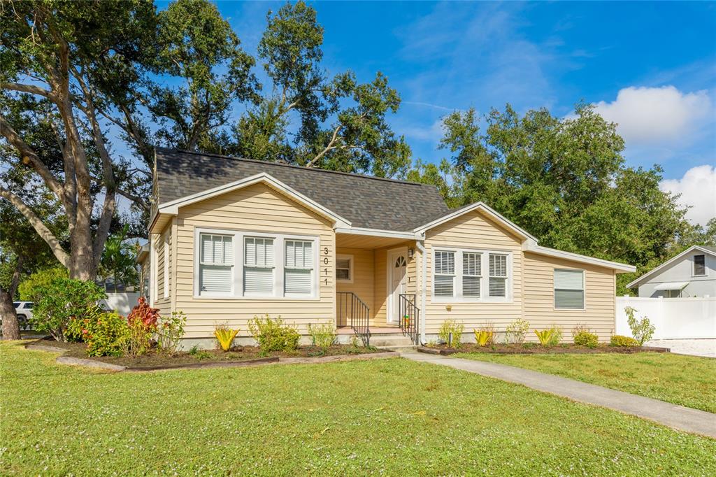 3011 6th Street Sarasota, FL 34237 - Photo 2 of 23 a front view of a house with a yard