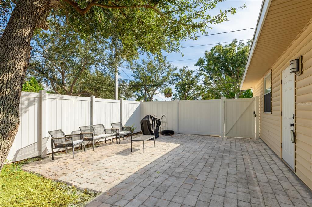 3011 6th Street Sarasota, FL 34237 - Photo 21 of 23 a backyard of a house with table and chairs